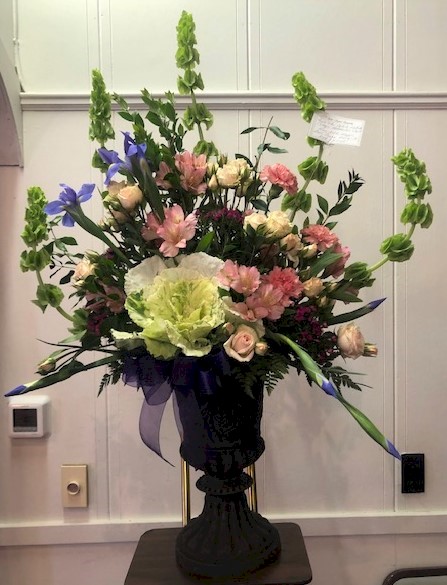 Flowers from Oglala Lakota College's Humanities Department: Kim, Nikki, Maggie, Bret, Connie, Marty Jr., Nick, and Keith