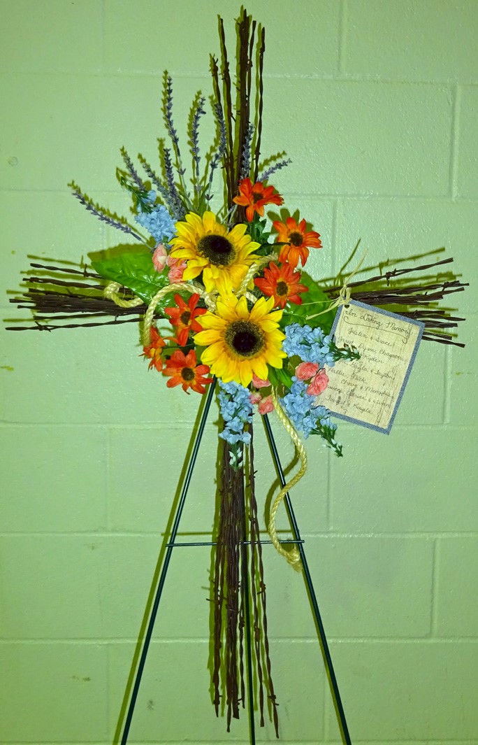 Flowers from Justin & Trace; Jared, Dyson, Chayson, Lyan, & Kyden; Roger, Gayla, & Tayton; Hallie, Nick, Chevy, & Memphis; Jessica, Adrian & Ivan; and Forrest & Kayela