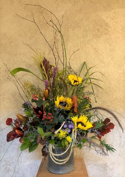 Flowers from Brandon and Sue Berguin and Family; Bryan and Tanya Schnell, Sam and Hallie, Alex and Maddie, and Eli and Josie; and Mike Moorehouse